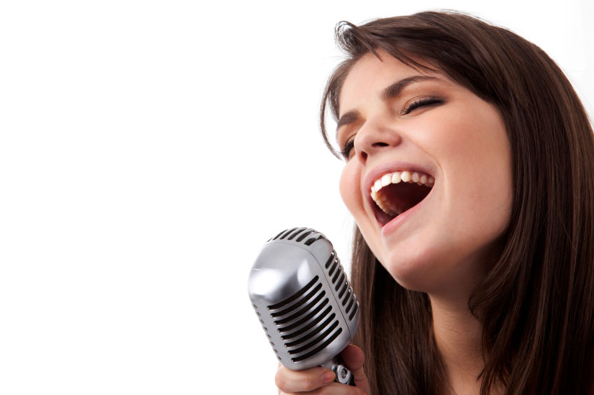 someone singing into a microphone