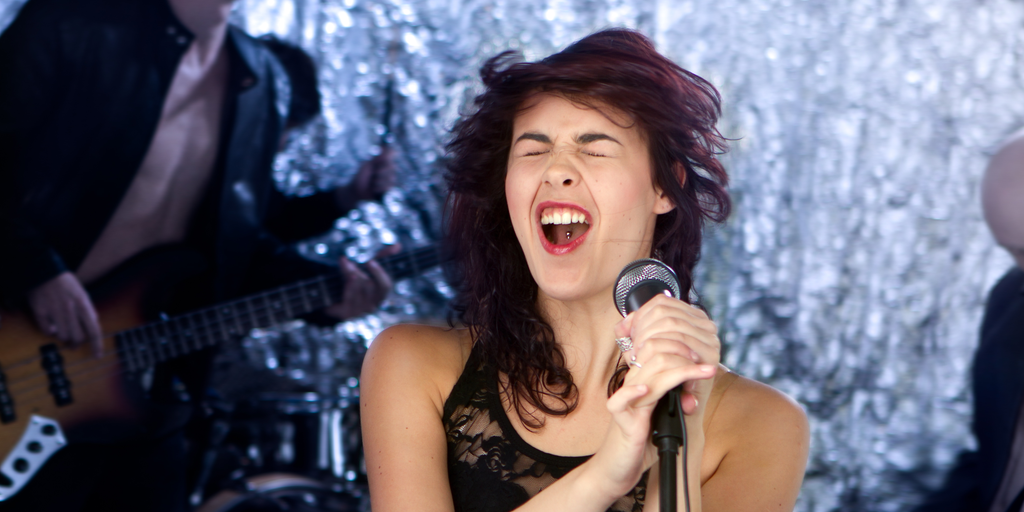 Lead female vocalist belting a high note