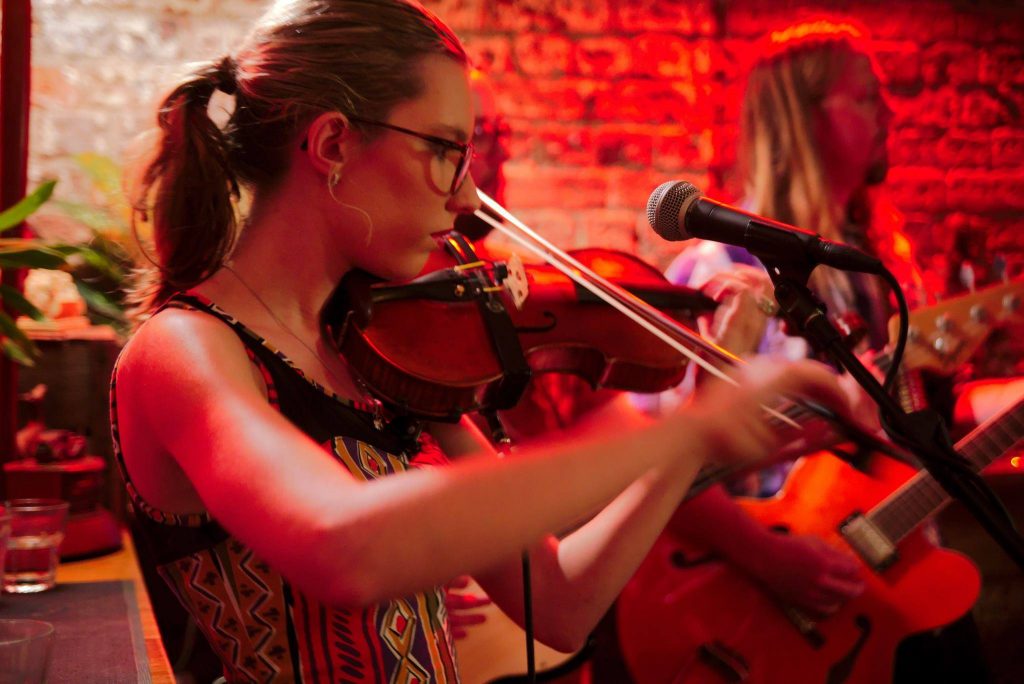 Performer playing a violin.